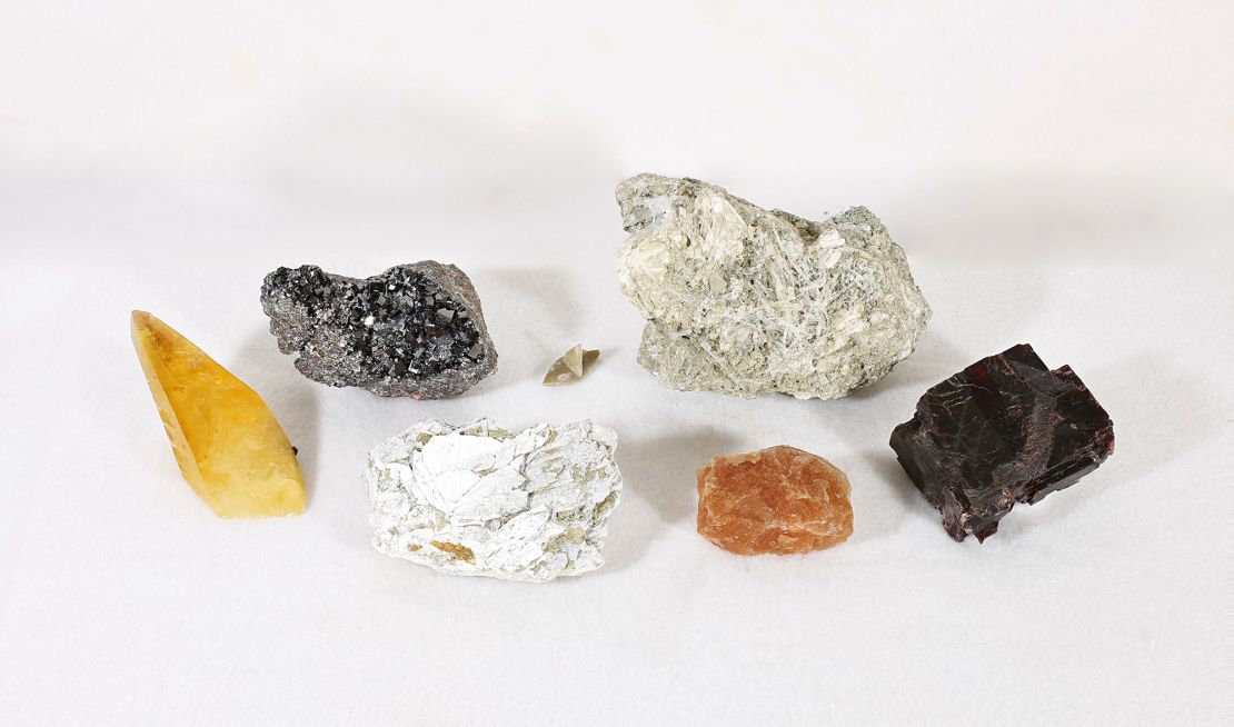 These are Earth-originating examples of minerals found in Bennu samples from the US National Mineral Collection at the Smithsonian’s National Museum of Natural History: (foreground, from left) calcite, gaylussite, sylvite with halite and villiaumite; and (background, from left) magnetite, thenardite and trona. Four of the minerals had not been previously observed in extraterrestrial samples: gaylussite, villiaumite, thenardite, trona.