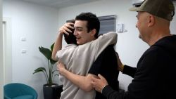 In this photo released by the IDF, Edan Alexander hugs a family member in Re’im, southern Israel, following his release on May 12.