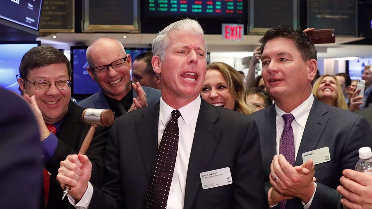 This 2018 photo shows Chris Wright ringing a ceremonial bell to celebrate the companies IPO on the floor of the New York Stock Exchange shortly after the opening bell in New York.
