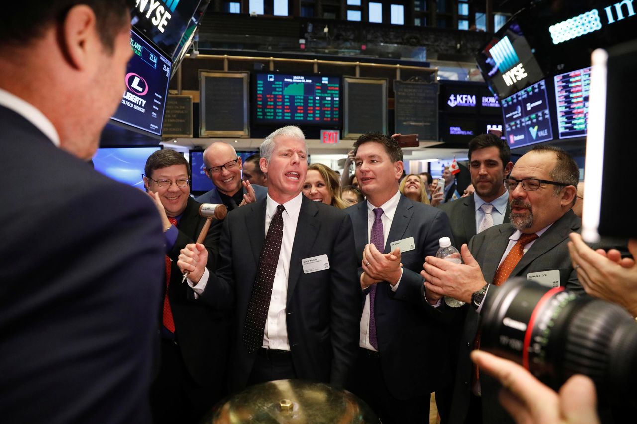 This 2018 photo shows Chris Wright ringing a ceremonial bell to celebrate the companies IPO on the floor of the New York Stock Exchange shortly after the opening bell in New York.