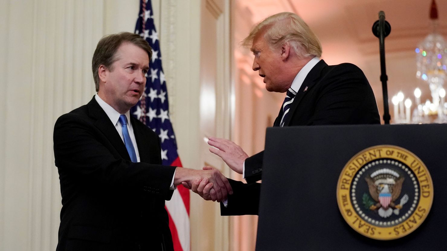 Supreme Court Associate Justice Brett Kavanaugh talks with US President Donald Trump during his ceremonial public swearing-in at the East Room of the White House in Washington, DC, on October 8, 2018. 