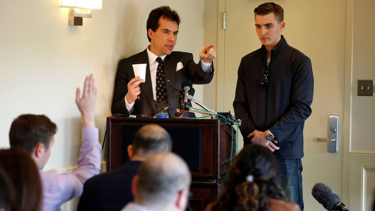 In this November 2018 photo, Jack Burkman, a lawyer and Republican operative, and Jacob Wohl, an internet activist and supporter of then-President Donald Trump, speak during a news conference on their allegations against Special Counsel Robert Mueller in Arlington, Virginia. 