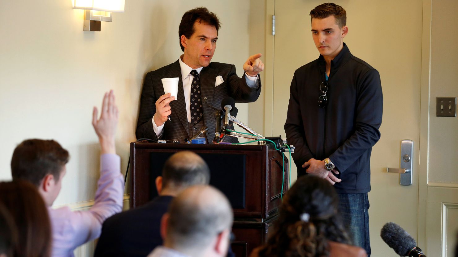 In this November 2018 photo, Jack Burkman, a lawyer and Republican operative, and Jacob Wohl, an internet activist and supporter of then-President Donald Trump, speak during a news conference on their allegations against Special Counsel Robert Mueller in Arlington, Virginia. 