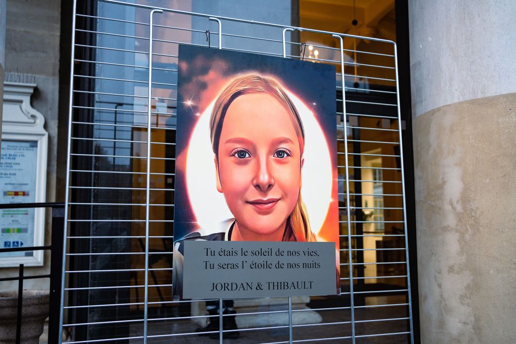 Poster showing a drawn portrait of murdered schoolgirl Lola Daviet during a march on November 16, 2022, in Paris, France.
