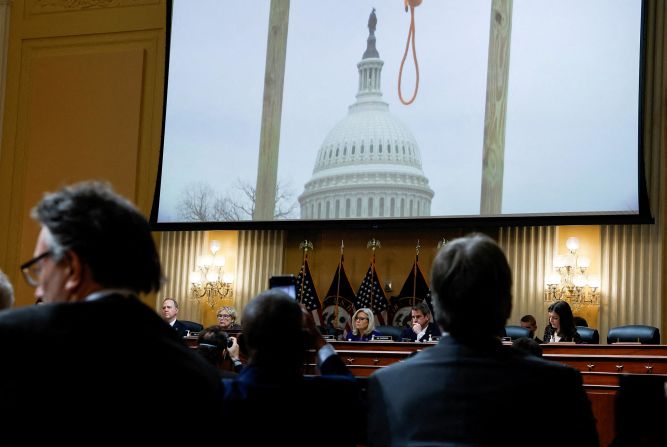 An image of a hangman's noose, seen outside the US Capitol on January 6, 2021, is displayed during the House select committee's final public meeting in December 2022.