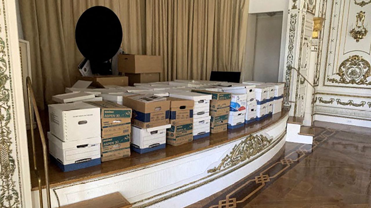 This photo from the US Justice Department shows what the Justice Department says are boxes of documents stored on the stage of the White and Gold Ballroom at Trump's Mar-a-Lago club in Florida in early 2021.