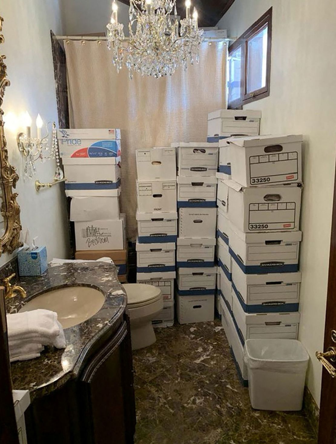 This photo from the US Justice Department shows what the Justice Department says are boxes of documents stored in a bathroom at Trump's Mar-a-Lago club in Florida in early 2021.