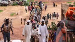 This August 2023 photo shows sudanese people, who fled the conflict in Murnei in Sudan's Darfur region, crossing the border between Sudan and Chad.