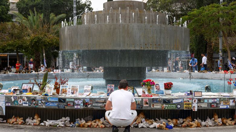 A man looks at memorabilia and pictures of the hostages kidnapped in the deadly October 7 attack on Israel by the Palestinian Islamist group Hamas from Gaza, displayed at Dizengoff Square in Tel Aviv, Israel, on March 27.