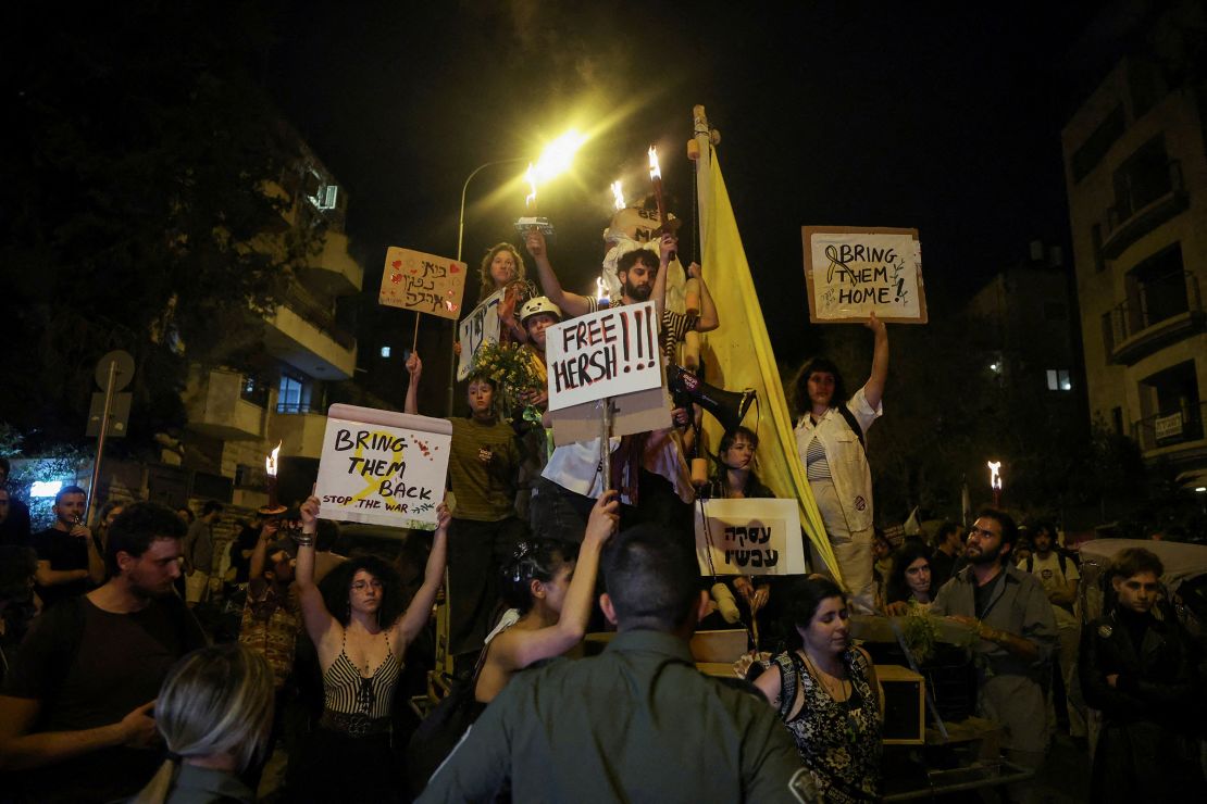 Protesters hold signs in support of Gaza hostages near Prime Minister Benjamin Netanyahu's residence, during a demonstration calling for his ouster, in the wake of the deadly October 7 attack on Israel by the Palestinian Islamist group Hamas and the ensuing war in Gaza, in Jerusalem, April 2, 2024.