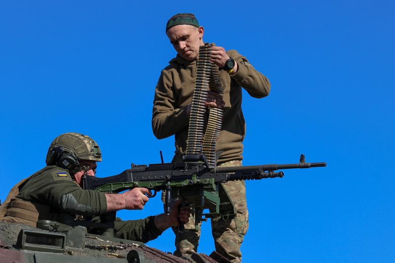 Service members of the 37th Marine Brigade of the Ukrainian Armed Forces use a machine gun atop of a French AMX-10 RC armored fighting vehicle during military drills in an undisclosed location in Southern Ukraine on April 3.