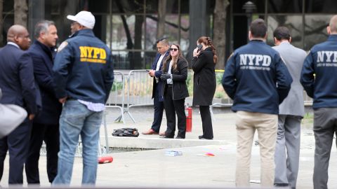 Emergency personnel respond to a report of a person covered in flames outside the courthouse where former US President Donald Trump's criminal hush money trial is underway, in New York, on April 19.