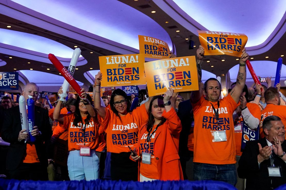 People chant before President Joe Biden delivers his remarks at a conference held by the North America's Building Trades Unions at the Washington Hilton, in Washington, DC, on April 24. 
