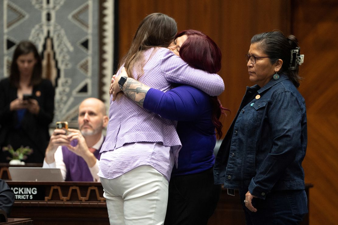 Arizona State Rep. Stephanie Stahl Hamilton is hugged by Arizona State Sen. Anna Hernandez after Arizona House Democrats repealed an 1864 law that bans nearly all abortions, during a state legislative session at the Arizona State Capitol in Phoenix on April 24.