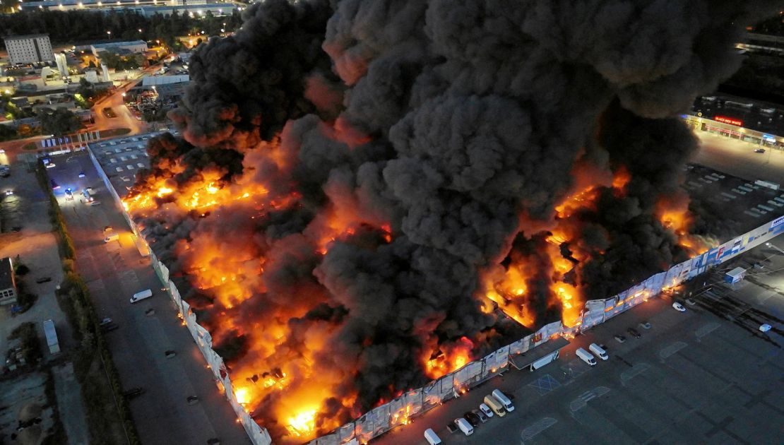 Drone view of the Marywilska 44 shopping centre burning during a massive fire in Warsaw, Poland, on May 12, 2024.