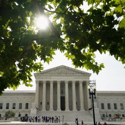 People line up to get into the US Supreme Court on the day where decisions ares expected to be handed down, in Washington, DC, on June 26. 