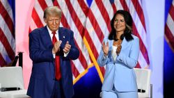 Donald Trump and Tulsi Gabbard gesture as they attend a town hall event in La Crosse, Wisconsin, on August 29.