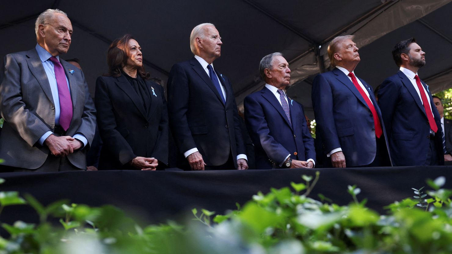 Senate Majority Leader Chuck Schumer, Vice President Kamala Harris, President Joe Biden, former New York City Mayor Mike Bloomberg, former President Donald Trump and US Sen. JD Vance attend a ceremony marking the 23rd anniversary of the September 11, 2001, attacks on the World Trade Center at the 9/11 Memorial and Museum in the Manhattan borough of New York City on September 11.