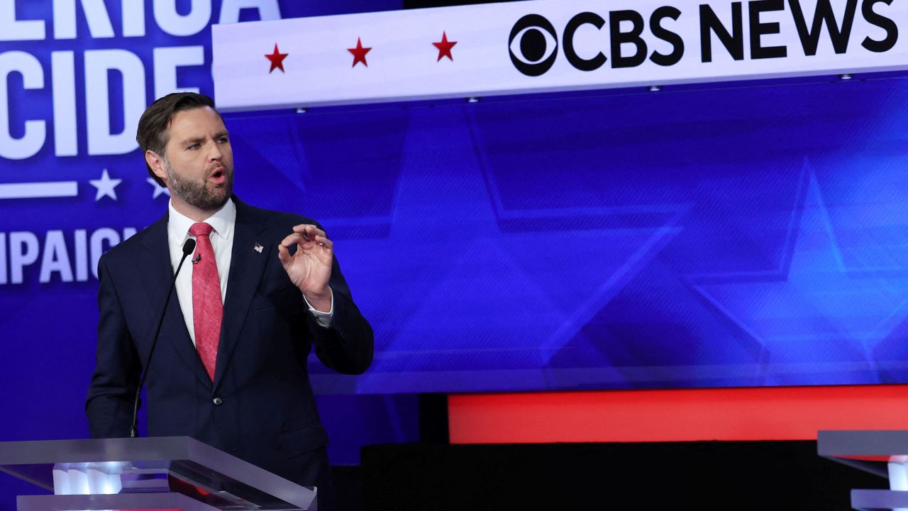 Vance gestures as he speaks during a debate.