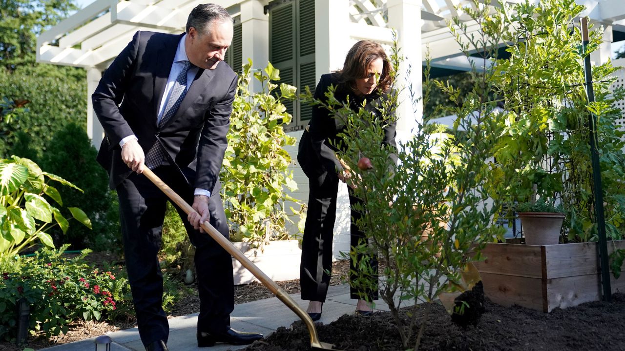 Vice President Kamala Harris, right, and Second Gentleman Doug Emhoff plant a tree to mark the one year anniversary of the Oct. 7 Hamas attacks on Israel, at the Vice President's residence at the US Naval Observatory in Washington, DC, on October 7. 