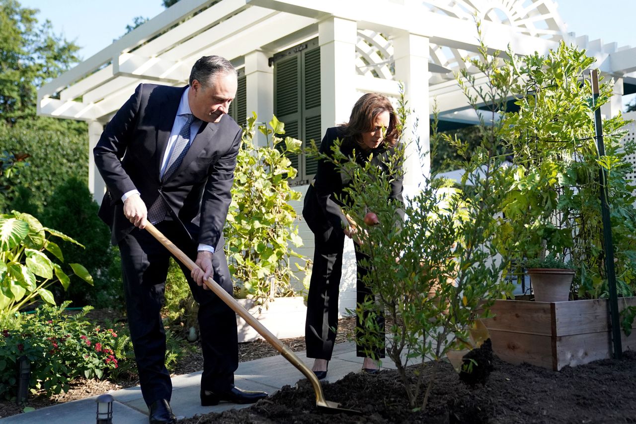 Vice President Kamala Harris, right, and Second Gentleman Doug Emhoff plant a tree to mark the one year anniversary of the Oct. 7 Hamas attacks on Israel, at the Vice President's residence at the US Naval Observatory in Washington, DC, on October 7. 