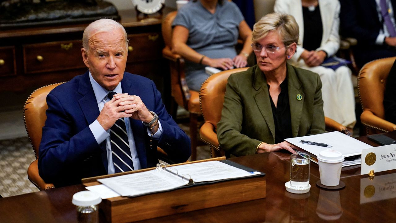 President Joe Biden speaks about the federal government response to Hurricane Helene and preparations for Hurricane Milton, as he sits next to Secretary of Energy Jennifer Granholm, from the Roosevelt Room of the White House in Washington, DC, on October 8. 