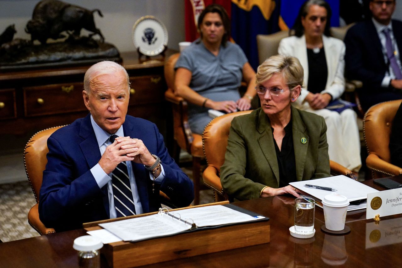 President Joe Biden speaks about the federal government response to Hurricane Helene and preparations for Hurricane Milton, as he sits next to Secretary of Energy Jennifer Granholm, from the Roosevelt Room of the White House in Washington, DC, on October 8. 