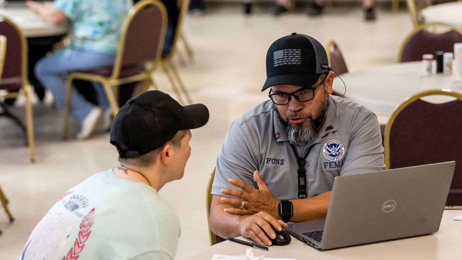 FEMA workers attend claims by a local residents after being affected by floods following the passing of Hurricane Helene, in Marion, North Carolina, on October 5.