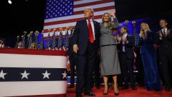 Former President Donald Trump stands on stage with his wife Melania at his rally, at the Palm Beach County Convention Center in West Palm Beach, Florida, on November 6.