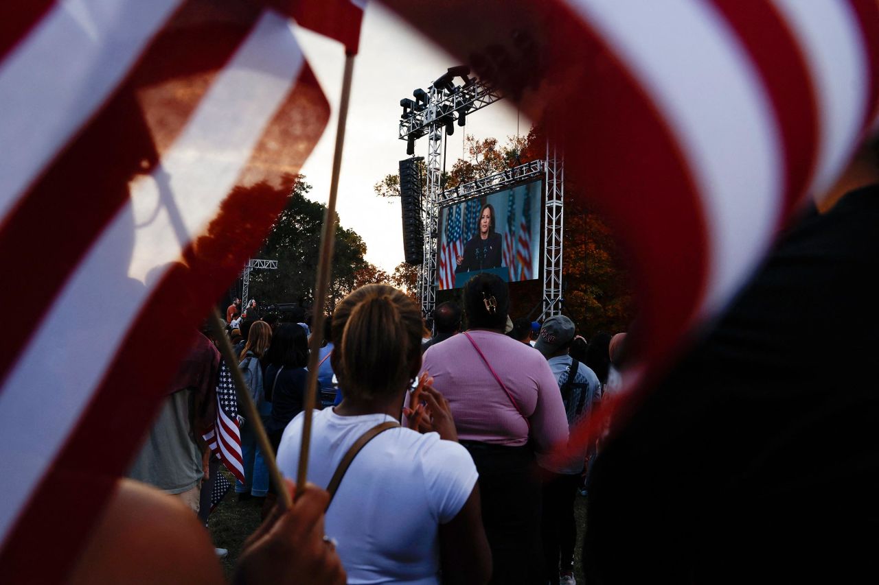 Supporters of Democratic presidential nominee Vice President Kamala Harris listen as she is seen in a screen delivering remarks, conceding the 2024 US presidential election to President-elect Donald Trump, at Howard University in Washington, DC, on November 6.