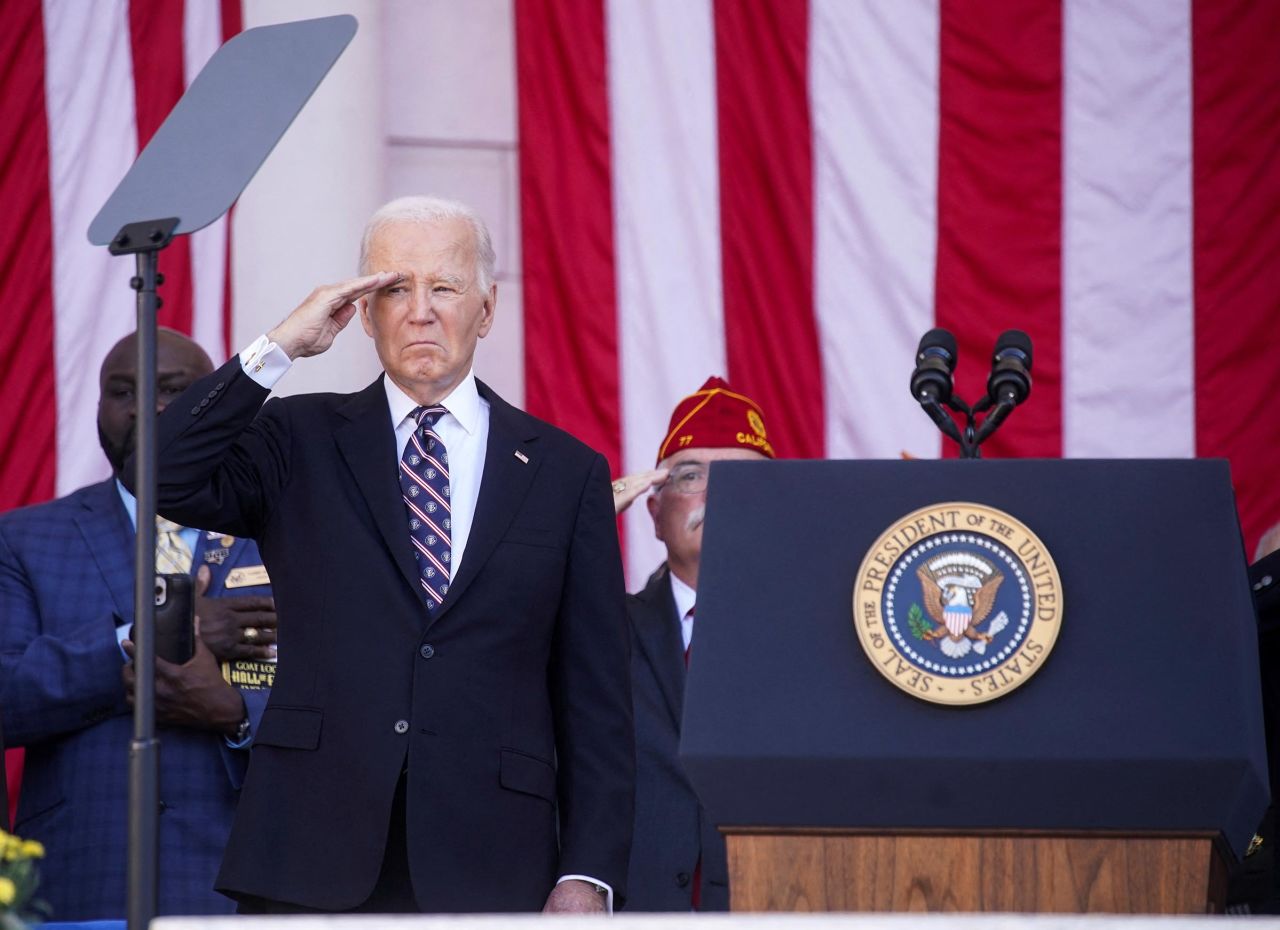 President Joe Biden salutes during the National Veterans Day Observance in Arlington National Cemetery in Arlington, Virginia, on Monday, November 11. 