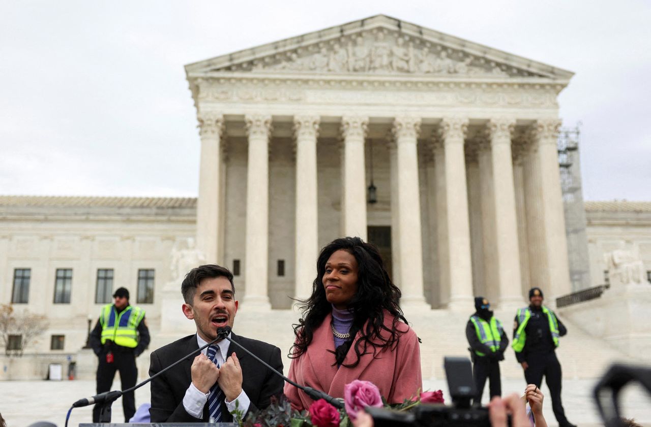 Chase Strangio, the first openly transgender person to argue in front of the US Supreme Court, speaks next to MC Peppermint outside the court following arguments over an appeal by President Joe Biden's administration of a lower court's decision upholding a Republican-backed ban in Tennessee on gender-affirming medical care for transgender minors, in Washington, DC, on Wednesday.