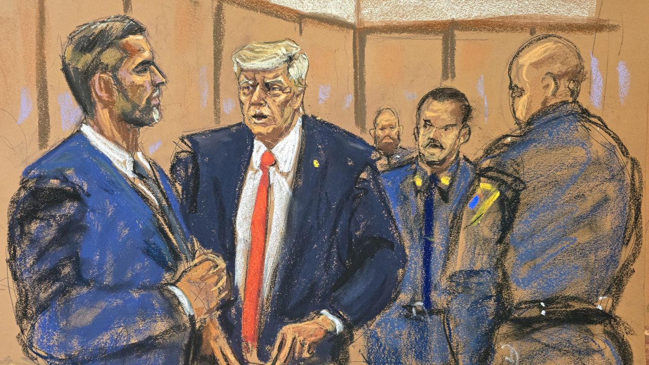 In this court sketch, former President Donald Trump stands as his son Eric Trump enters the courtroom during his criminal trial on charges that he falsified business records to conceal money paid to silence porn star Stormy Daniels in 2016, in Manhattan state court in New York City, on April 30.