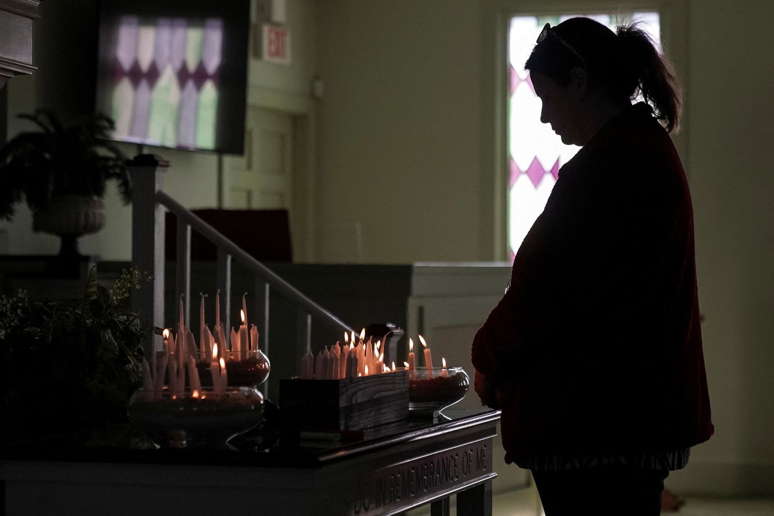 A woman pays her respects to Carter during a candlelight vigil at Maranatha Baptist Church in Plains, Georgia, on January 4.