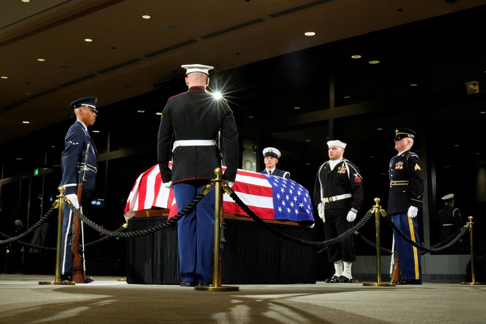 The Guard of Honor surrounds the flag-draped casket of former President Jimmy Carter as he lies in repose at the Jimmy Carter Presidential Library and Museum in Atlanta on Saturday, January 4. 