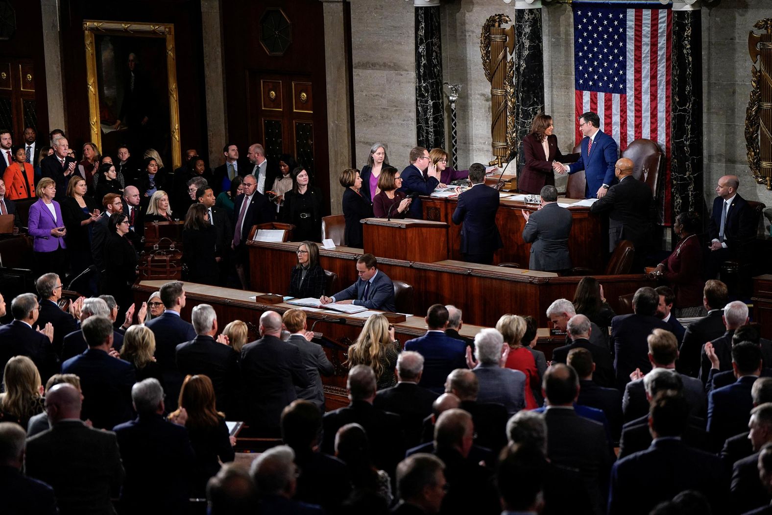 Vice President Kamala Harris and House Speaker Mike Johnson shake hands as they attend a joint session of Congress to certify Donald Trump's election at the US Capitol in Washington, DC, on January 6. 