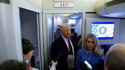President Donald Trump speaks to reporters with White House Press Secretary Karoline Leavitt aboard Air Force One before arriving at Joint Base Andrews, Maryland, on January 27. 