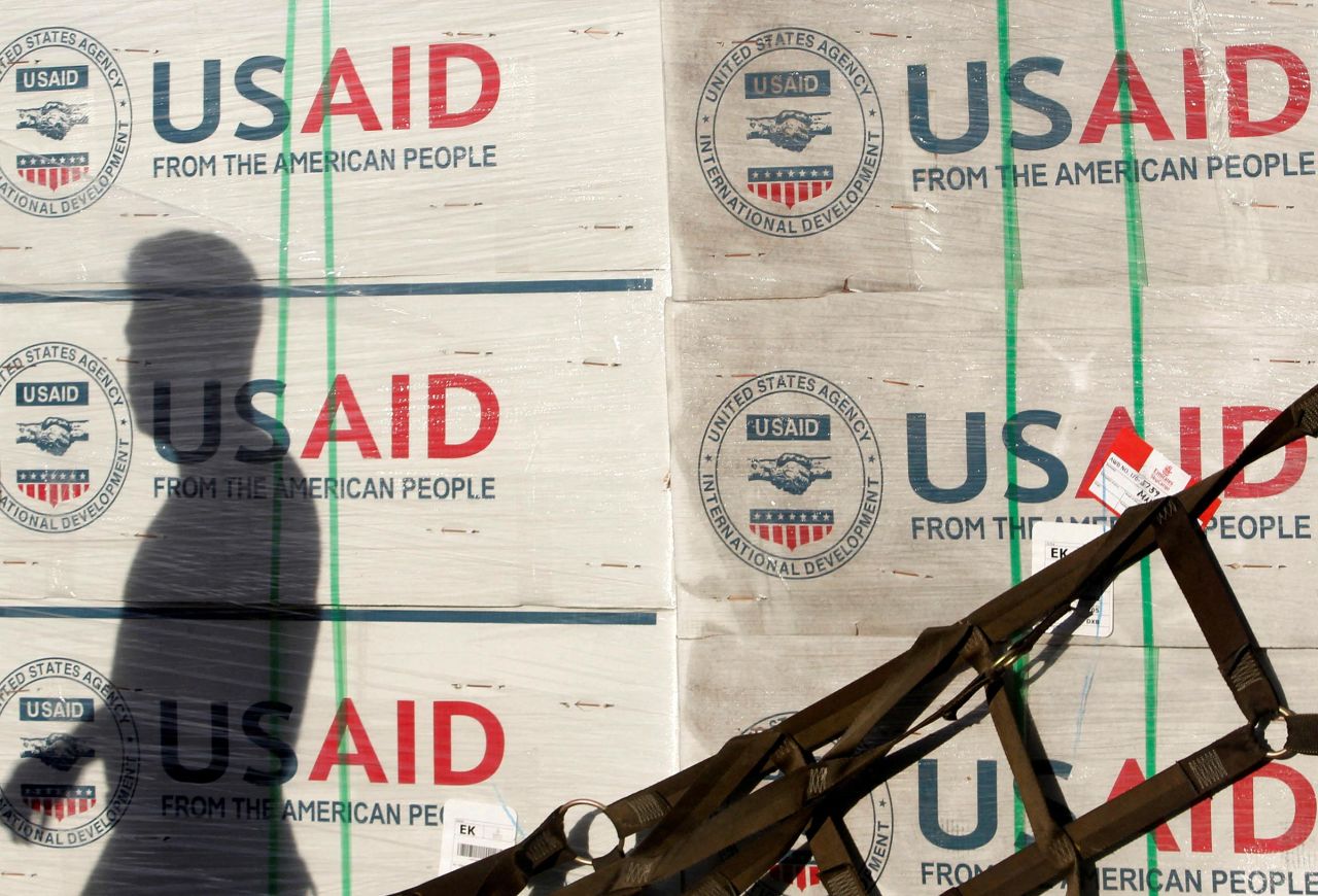 In this 2013 photo, a Philippine Army personnel is cast on boxes of relief items from US Agency for International Development (USAID) at Villamor Air Base in Manila November 13, 2013. 