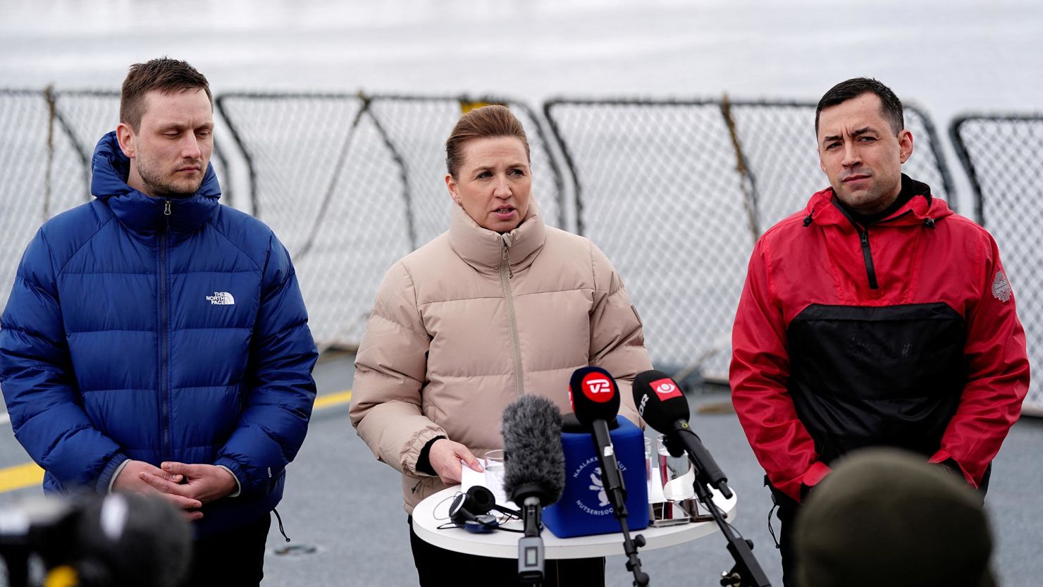 Danish Prime Minister Mette Frederiksen, center, attends a news conference aboard a Danish navy ship in Nuuk, Greenland, on Thursday with current head of government Múte B. Egede, right, and newly elected Greenlandic Prime Minister Jens-Frederik Nielsen.