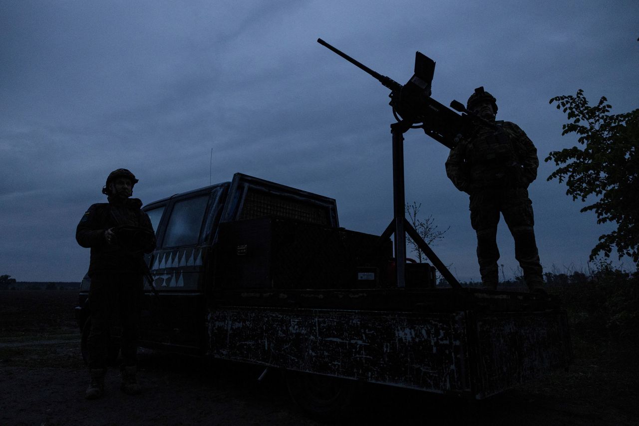Members of a mobile air defense volunteer unit stand next to their machine gun amid Russia's attack on Ukraine in Kyiv, Ukraine, on May 18.
