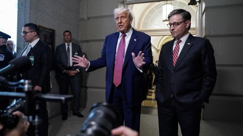 President Donald Trump gestures next to House Speaker Mike Johnson on Capitol Hill in Washington, DC, on May 20.