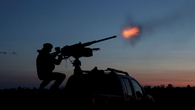 A Ukrainian Armed Forces serviceman fires a machine gun towards a Russian drone in the Kharkiv Region of Ukraine on June 2. 