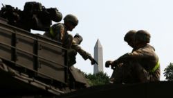 The Washington Monument is seen in the background as soldiers work on an M1A2/Abrams tank ahead of the upcoming US Army 250th anniversary celebration parade in Washington, DC, on June 11.