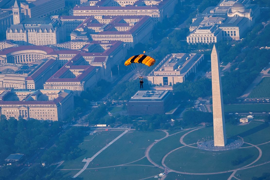 A member of the US Army Golden Knights parachute team jumps during their performance for the Twilight Tattoo ceremony as part of the Army’s 250th Birthday Festival in Washington, DC, after taking off from Joint Base Myer-Henderson Hall in Arlington, Virginia, on June 11.