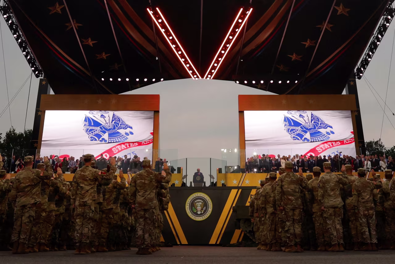 President Donald Trump administers the constitutional oath to 250 enlistees during the US Army’s 250th Birthday Parade in Washington, DC, on June 14.