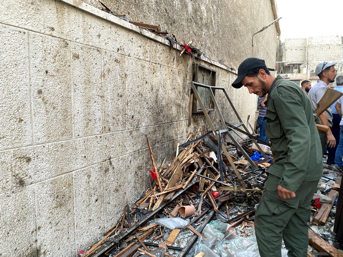 A member of the Syrian security force inspects the damage after a reported attack at the Mar Elias Church in the Dweila neighbourhood of Damascus, Syria on June 22. 