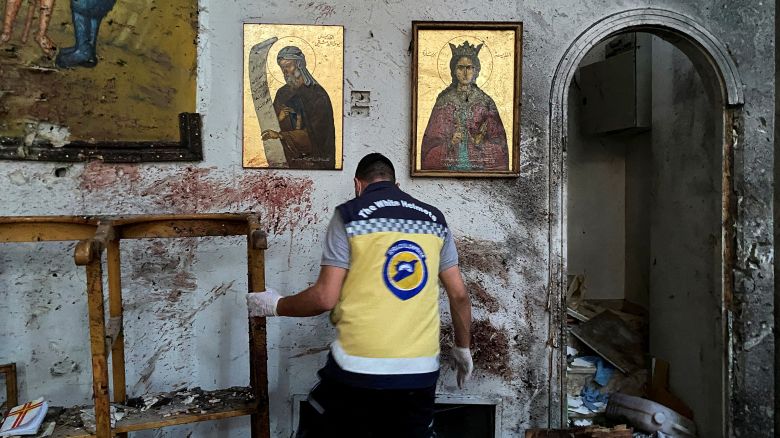 A civil defense member inspects the damage after a reported attack at the Mar Elias Church in the Dweila neighbourhood of Damascus, Syria, on June 22.