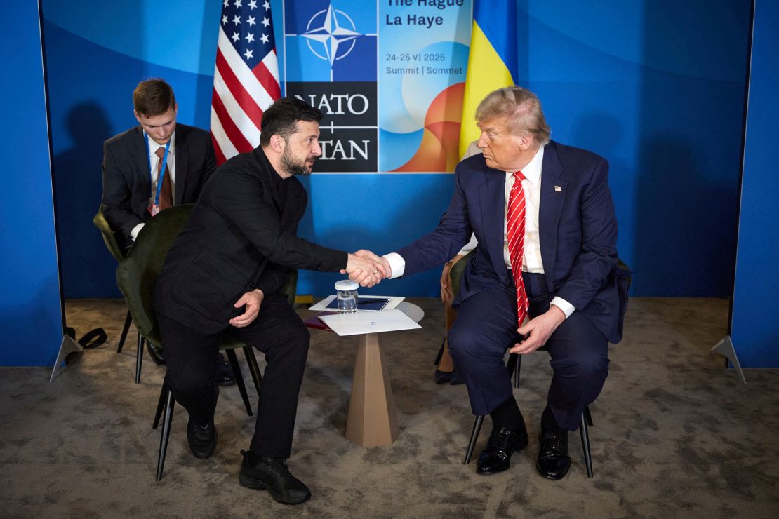 US President Donald Trump and Ukrainian President Volodymyr Zelensky shake hands as they attend a meeting on the sidelines of the summit Wednesday.