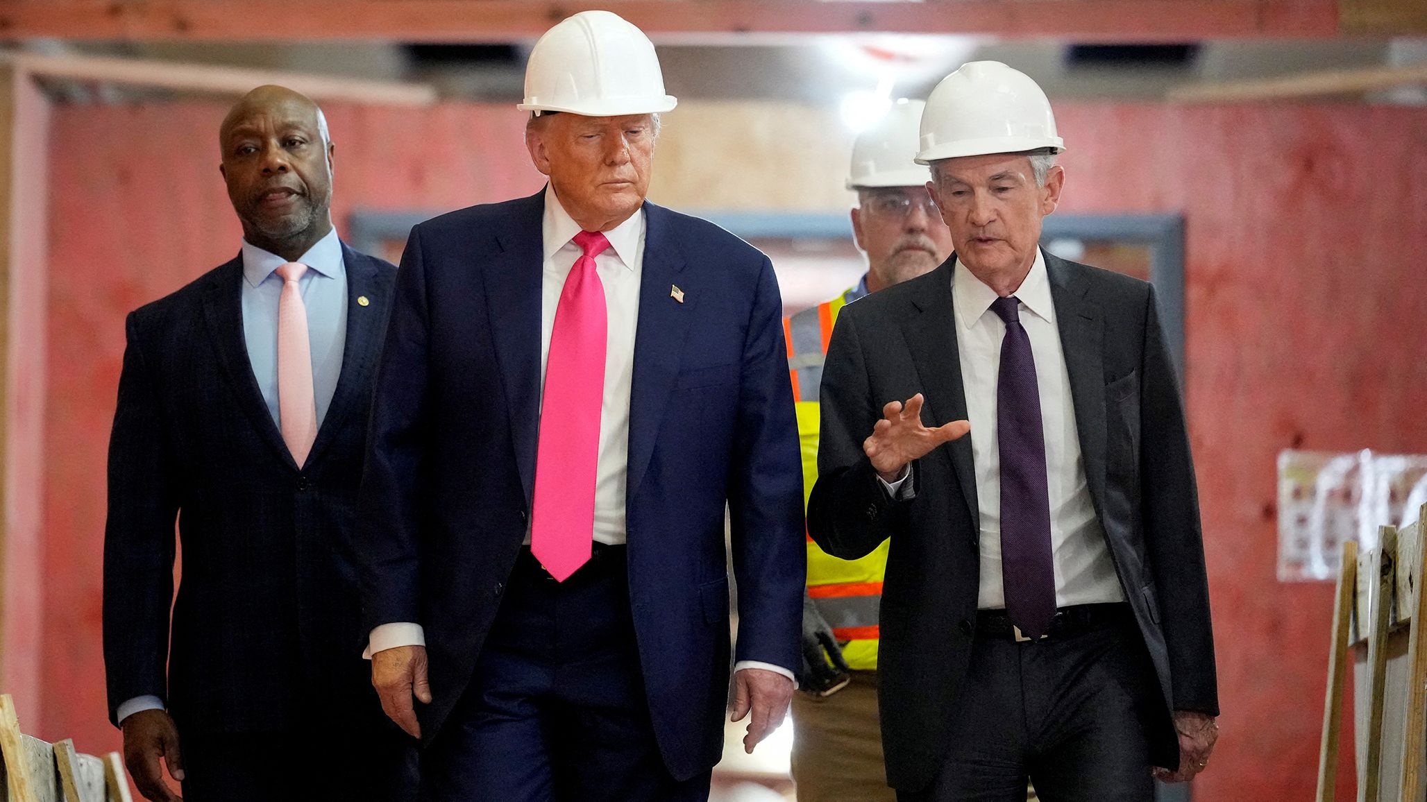 President Donald Trump, Federal Reserve Chair Jerome Powell, and US Senator Tim Scott tour the Federal Reserve Board building, which is currently undergoing renovations, in Washington, DC, on July 24. 