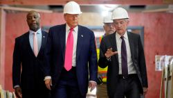 President Donald Trump, Federal Reserve Chair Jerome Powell, and US Senator Tim Scott tour the Federal Reserve Board building, which is currently undergoing renovations, in Washington, DC, on July 24. 